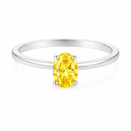 Yellow sapphire solitaire ring with a 6×4 mm oval in white gold-plated 925 silver. Elegant, minimal, and timeless for daily wear. Available now at BSI Jewelry.
