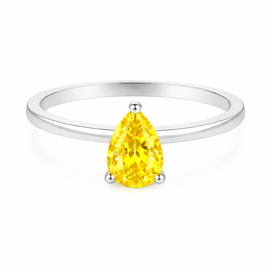 Yellow sapphire solitaire ring with a 6×4 mm pear in white gold-plated 925 silver. Elegant, minimal, and timeless for daily wear. Available now at BSI Jewelry.