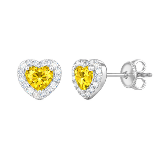 Yellow sapphire stud earrings with 4 mm heart cut in white gold-plated 925 silver, accented with moissanite and screw-back posts. Available now at BSI Jewelry.