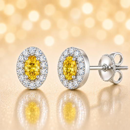 Yellow sapphire stud earrings with 5×3 mm oval in white gold-plated 925 silver, accented with moissanite and secure screw-back posts. Available now at BSI Jewelry.