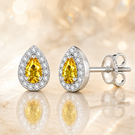Yellow sapphire stud earrings with 5×3 mm pear in white gold-plated 925 silver, accented with moissanite and secure screw-back posts. Available now at BSI Jewelry.