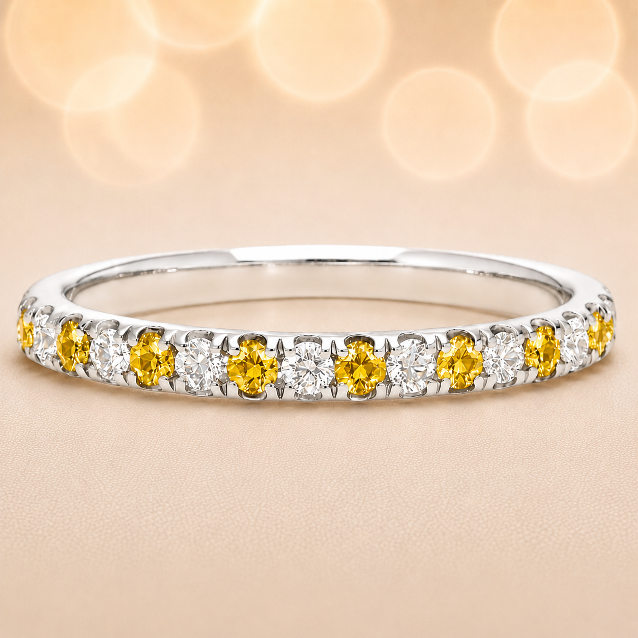 Yellow sapphire wedding band with 1.80 mm round-cut stones, crafted in white gold-plated 925 silver and accented with moissanite. Available now at BSI Jewelry.